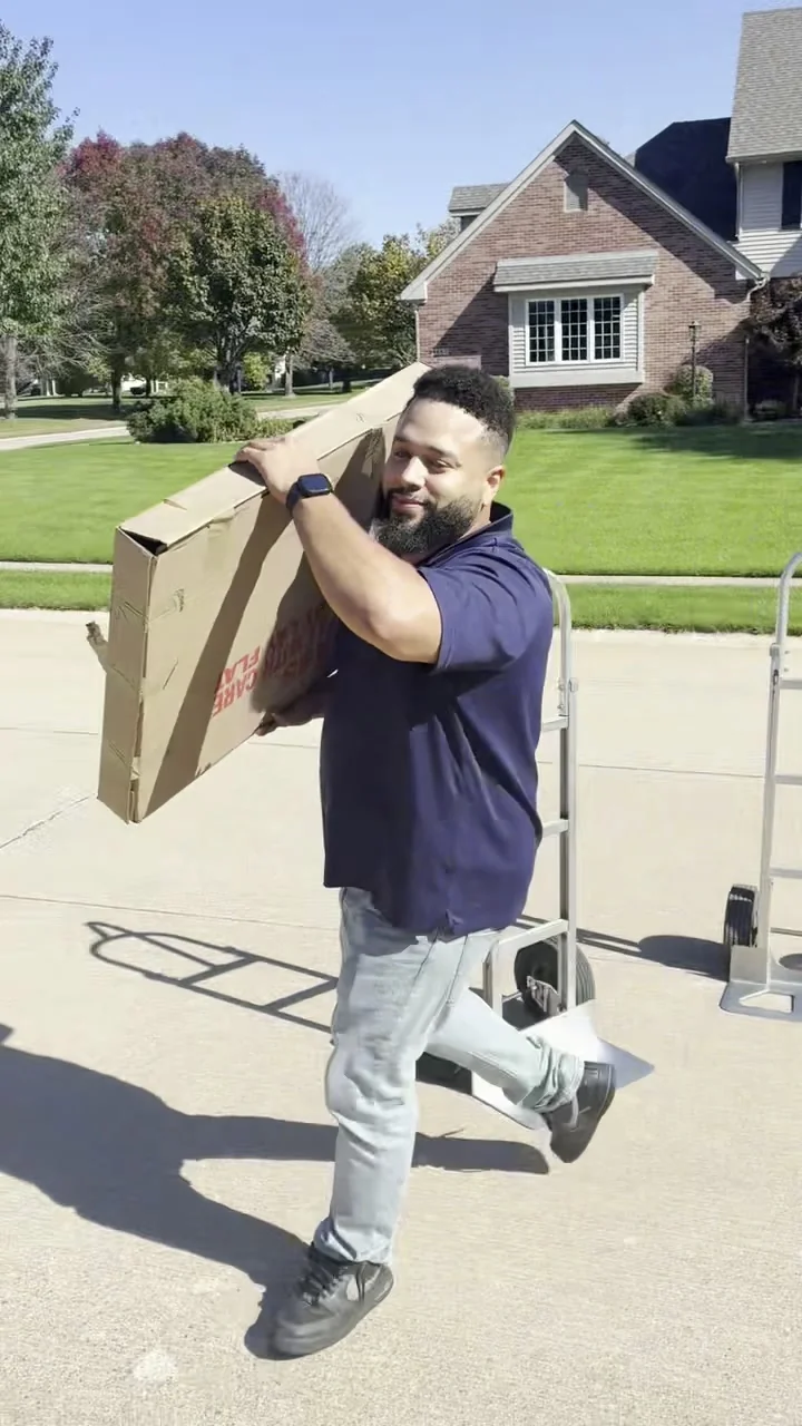 MVP Logistics mover carrying a packed box during a residential move